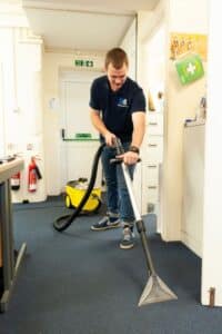 Scotts & Sons employee cleaning and office carpet