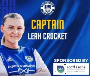 Captain Leah Crocket on a banner sponsored by Scott & Sons.