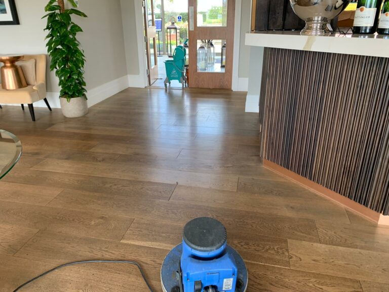 Interior view showcasing polished wood flooring, freshly cleaned by Scott & Sons team.